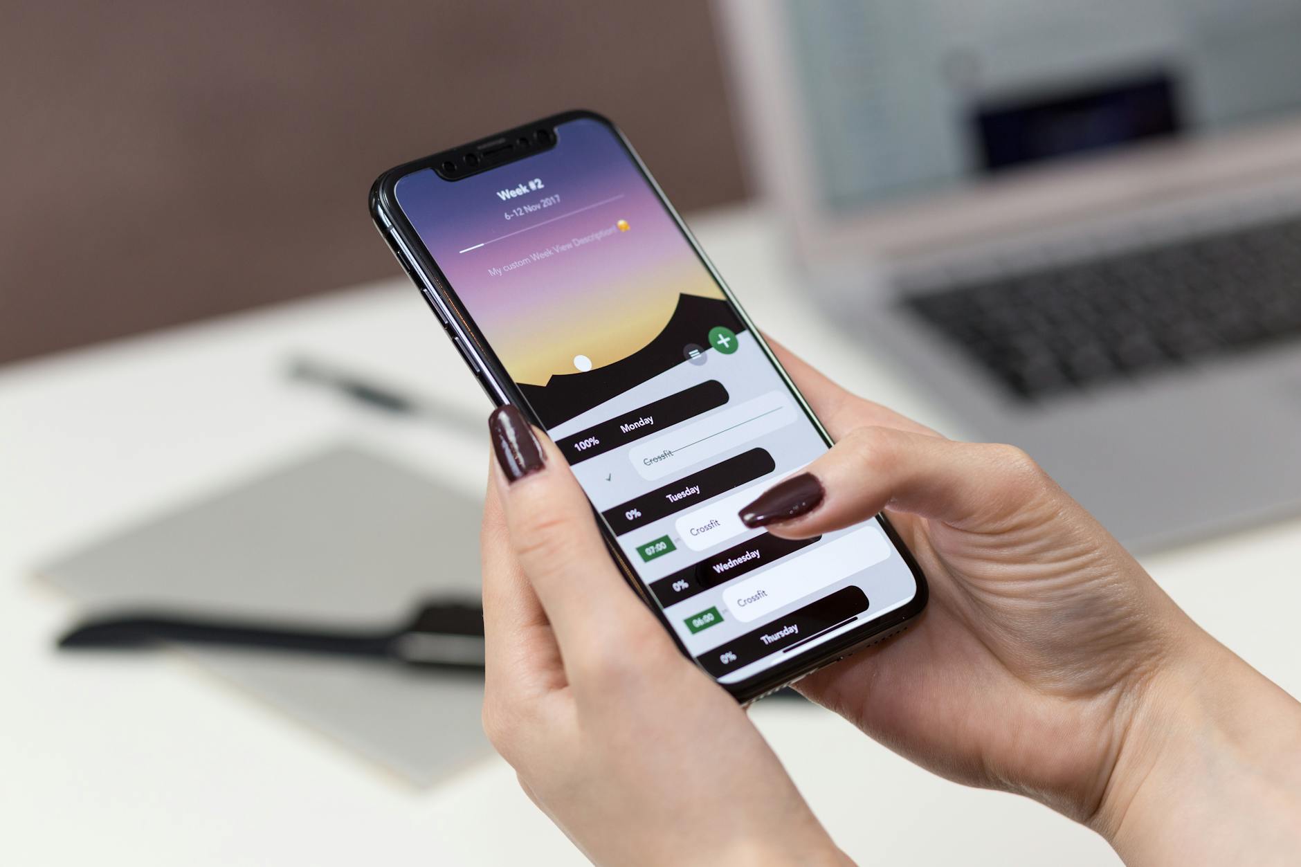 Person reviewing product analytics on a smartphone at a desk