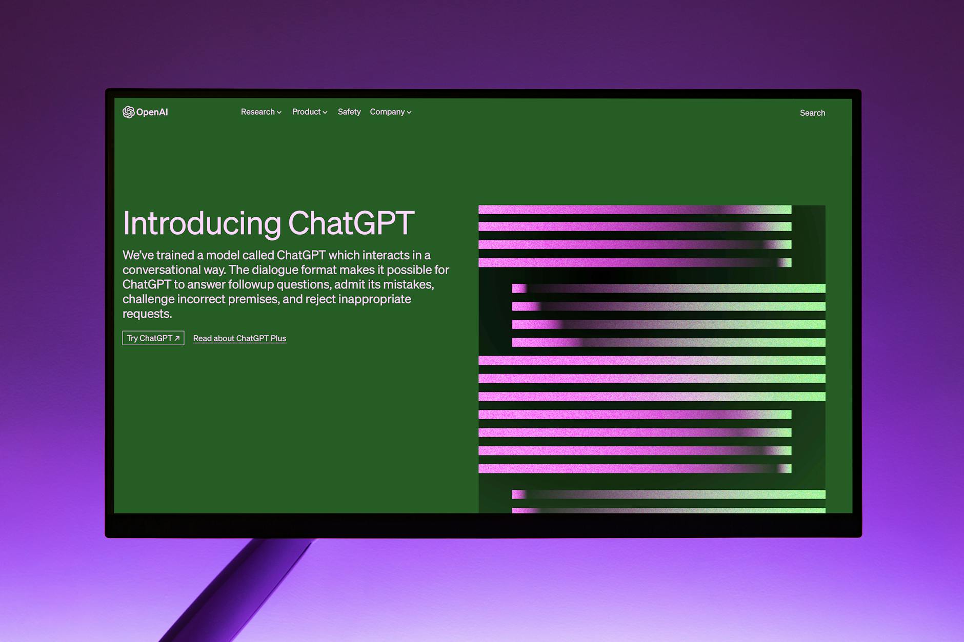 Computer monitor showing the OpenAI website with the introduction to ChatGPT