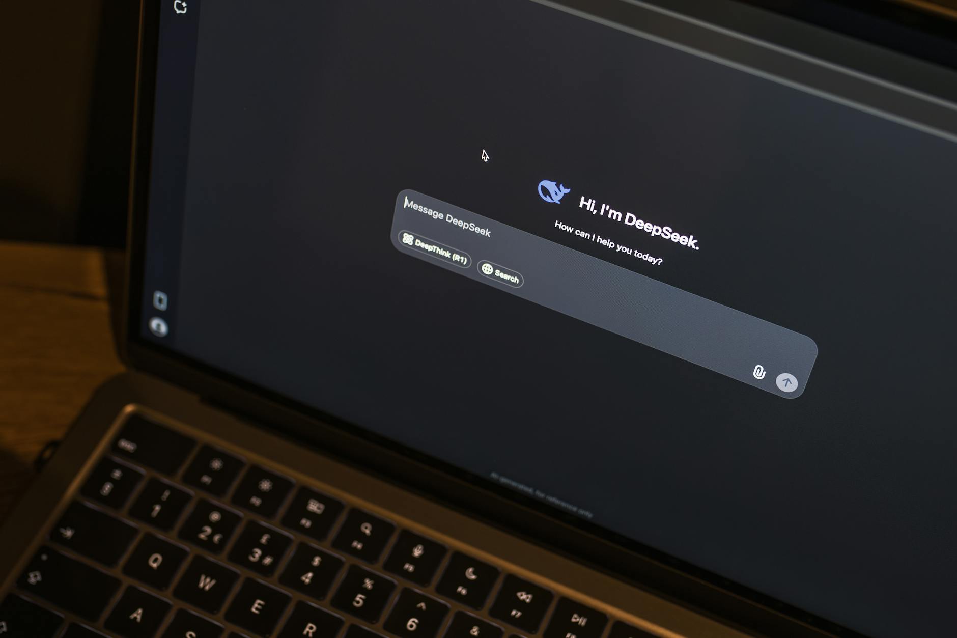 Laptop on a wooden table showing an AI chat interface in action