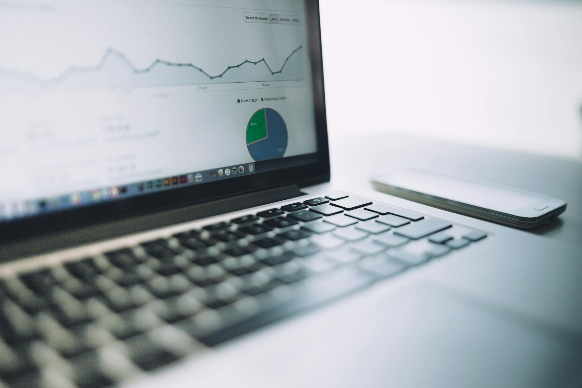 Laptop showing an analytics dashboard with charts — modern data analysis